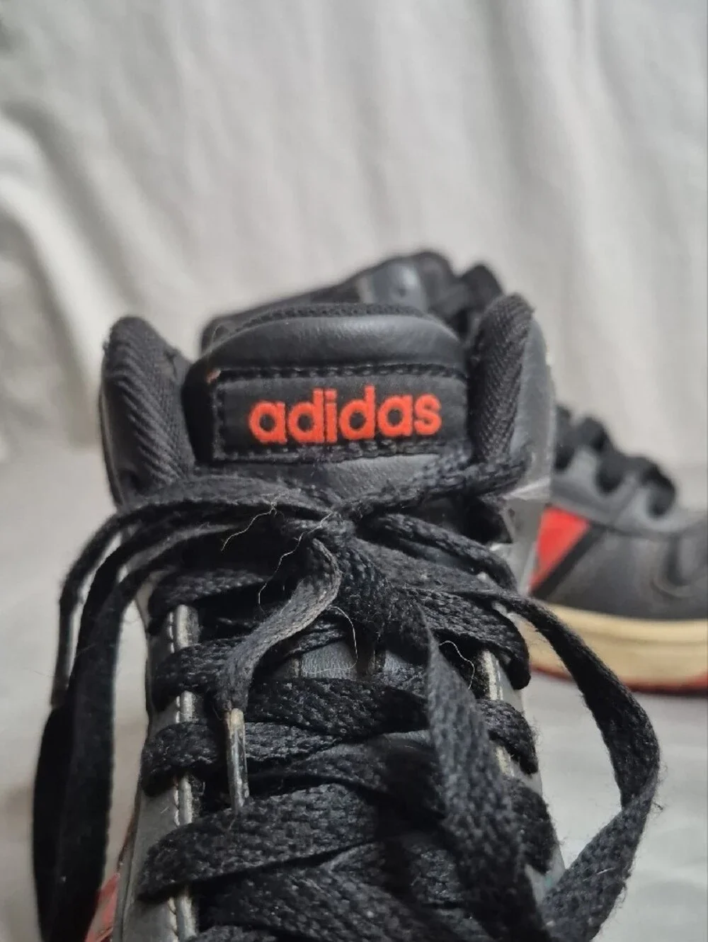 adidas Kids Black Sneakers with Red Stripes